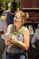 Picture of a woman holding a clipboard.